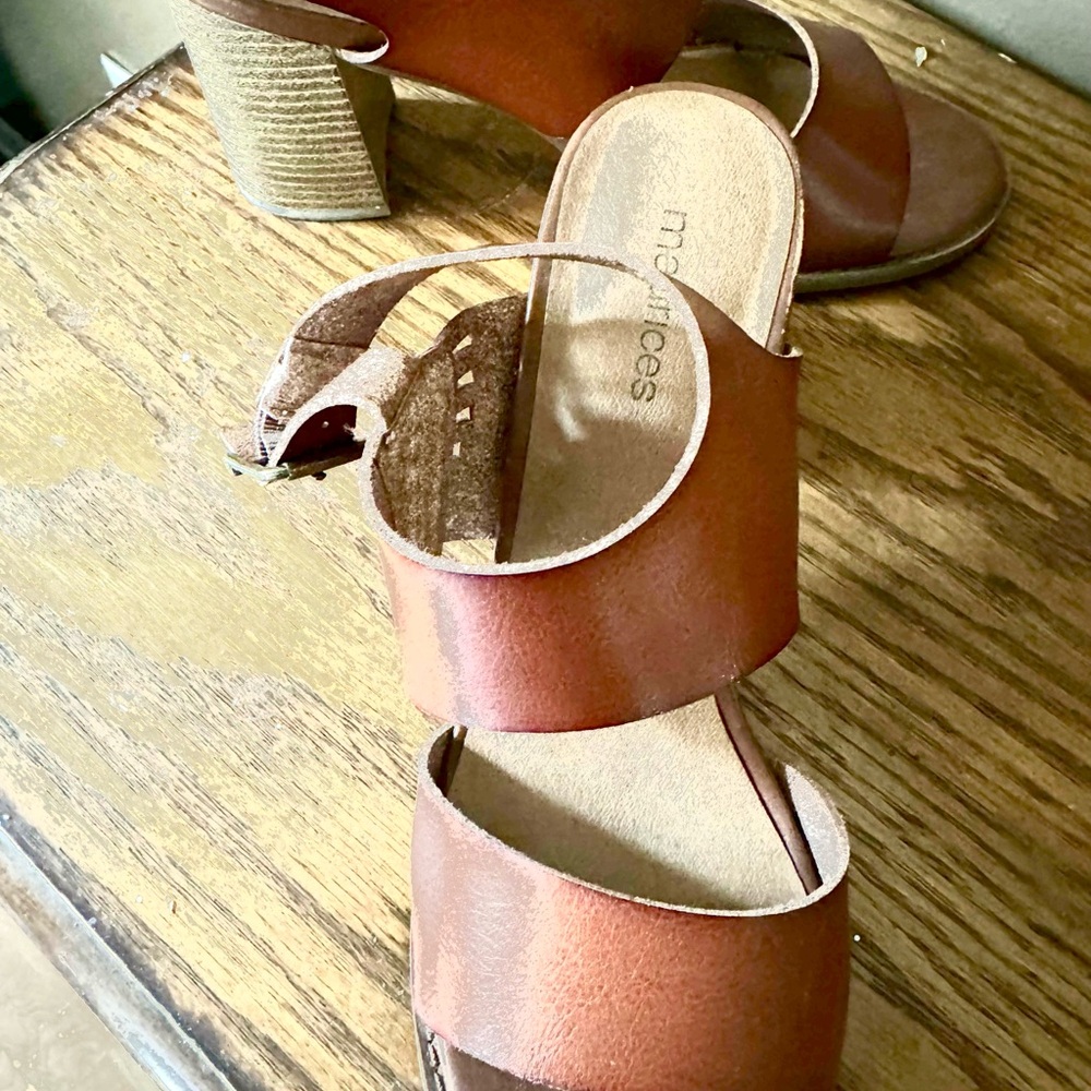 Brown gladiator style block heeled shoes.